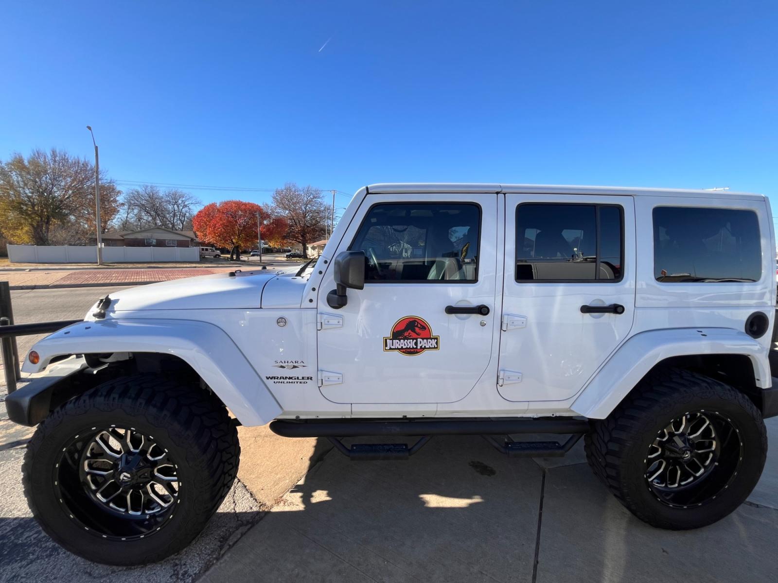 2017 WHITE JEEP WRANGLER UNLIMITED S Unlimited Sahara 4WD (1C4BJWEGXHL) with an 3.6L V6 DOHC 24V FFV engine, located at 8101 E. Skelly Dr., Tulsa, OK, 74129, (918) 592-3593, 36.121891, -95.888802 - Photo #1
